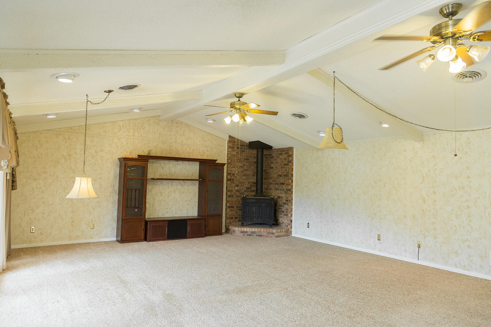 1209 Dallas Plainview, TX 79072 - Photo 23 of 57 a view of a livingroom with a ceiling fan and window