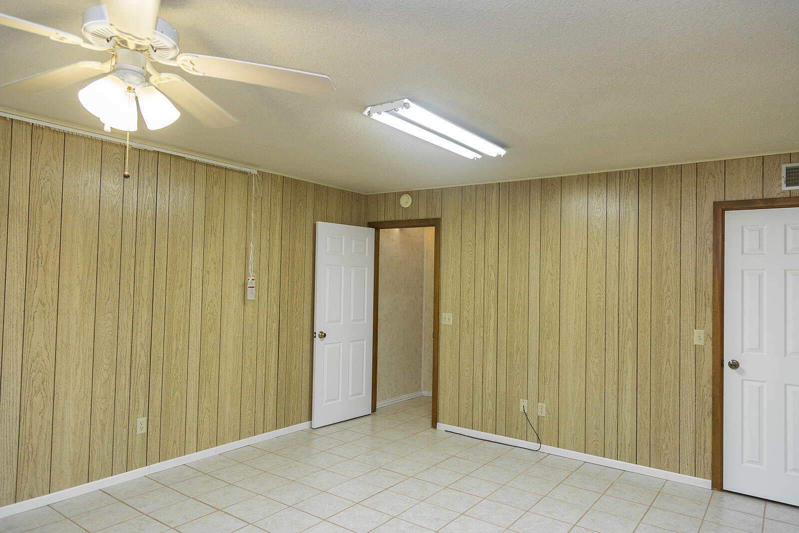 1209 Dallas Plainview, TX 79072 - Photo 32 of 57 wooden floor in an empty room with a window