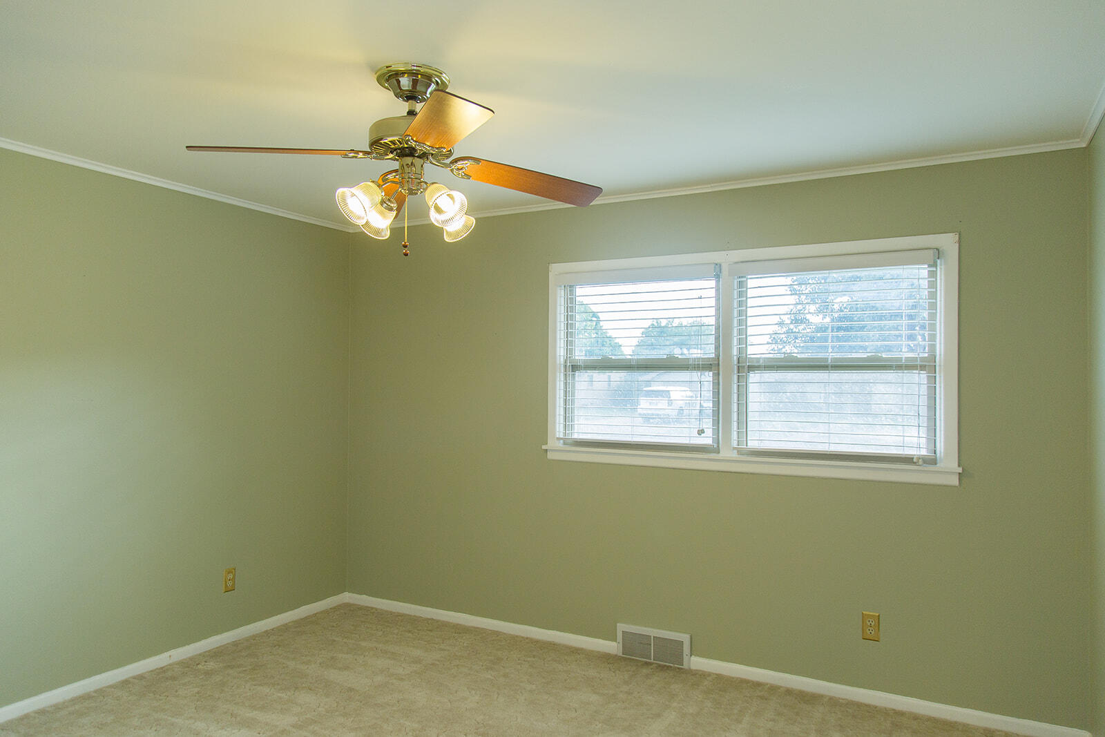 1209 Dallas Plainview, TX 79072 - Photo 34 of 57 an empty room with a window and a fan