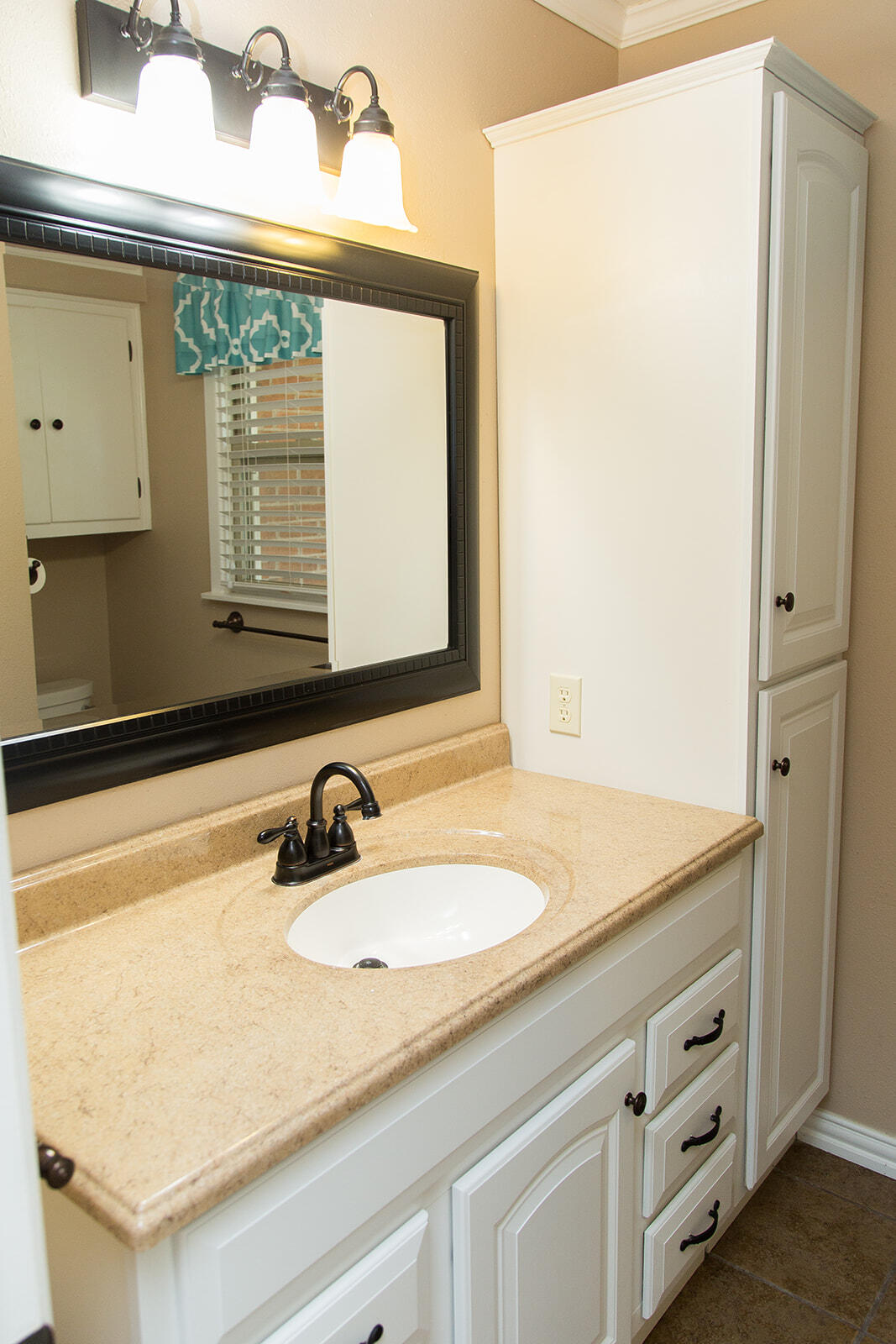 1209 Dallas Plainview, TX 79072 - Photo 46 of 57 a bathroom with a sink and a mirror