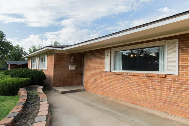 a view of livingroom with window and wooden floor