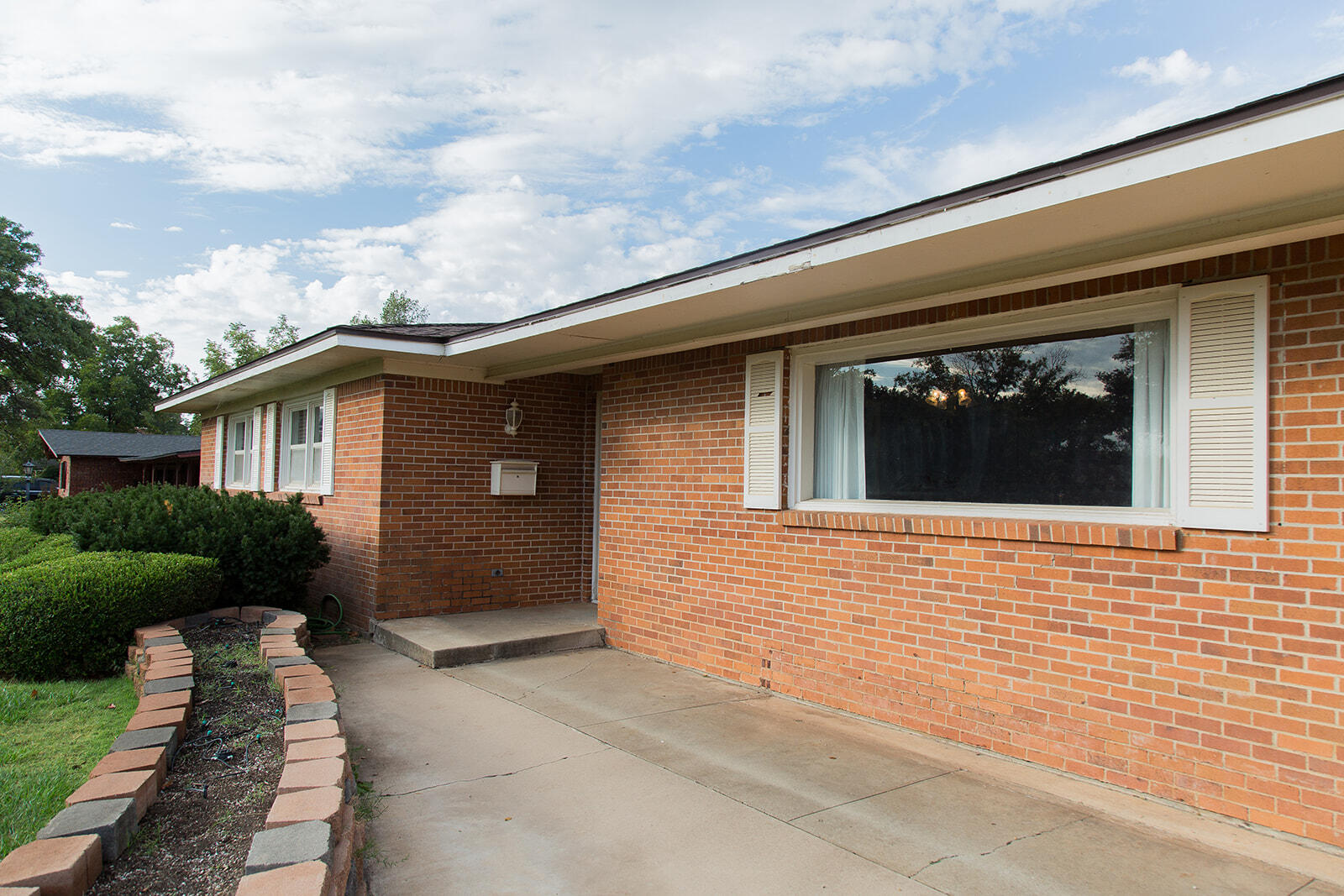 1209 Dallas Plainview, TX 79072 - Photo 5 of 57 a front view of a house with a yard
