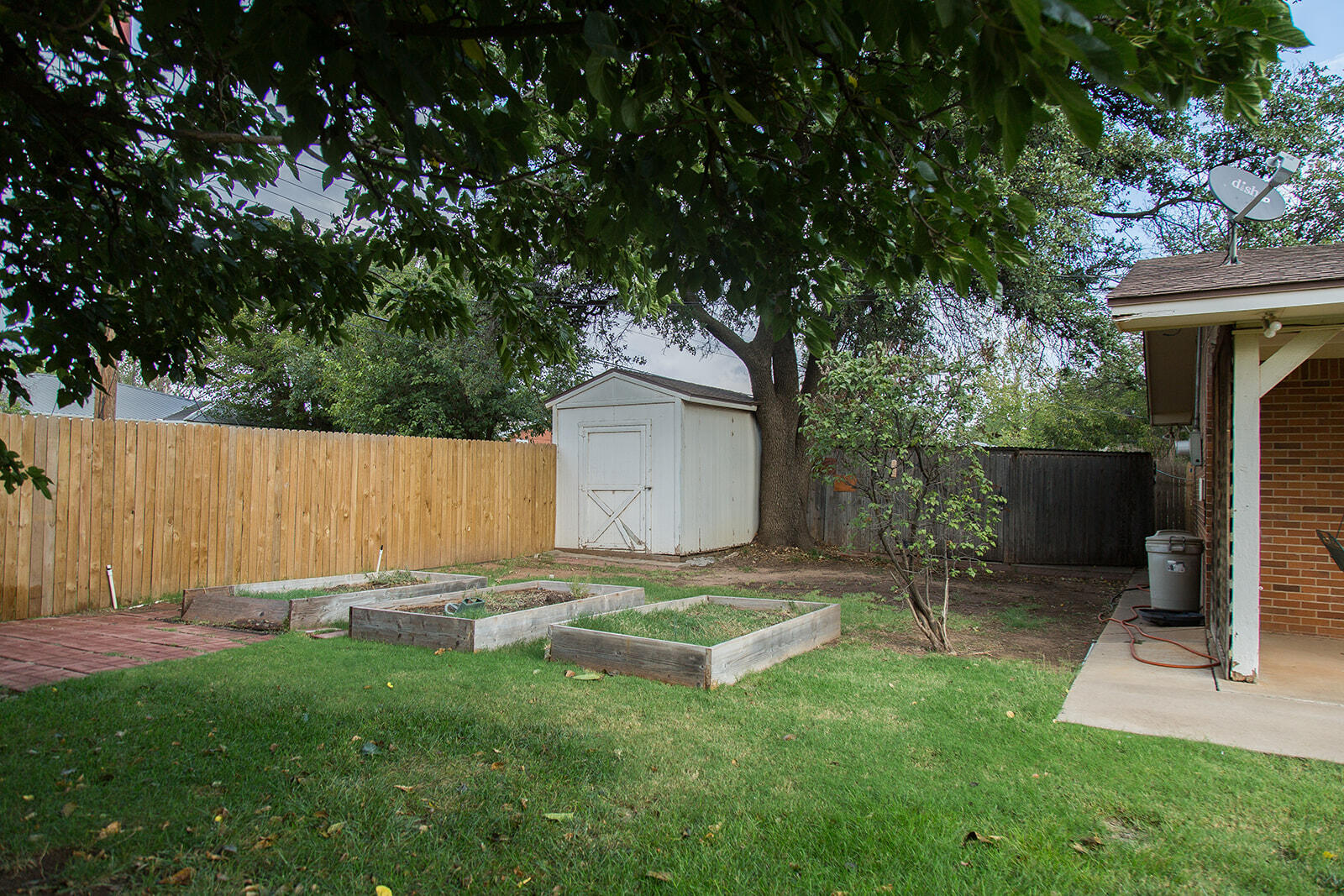 1209 Dallas Plainview, TX 79072 - Photo 56 of 57 a backyard of a house with table and chairs