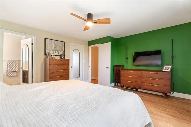 a bedroom with a bed and a dresser