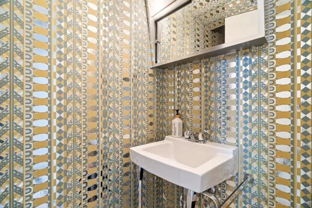 a bathroom with a shower curtain and sink