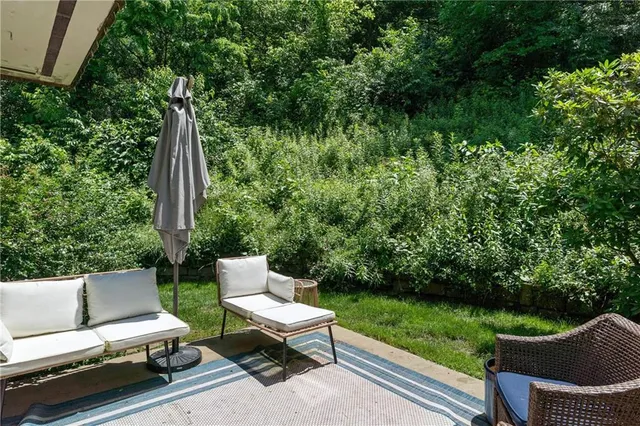 a view of a two chairs in the deck