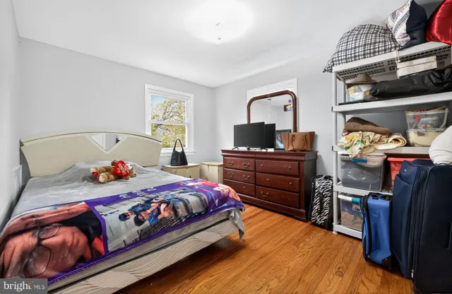 a bedroom with a bed and dresser