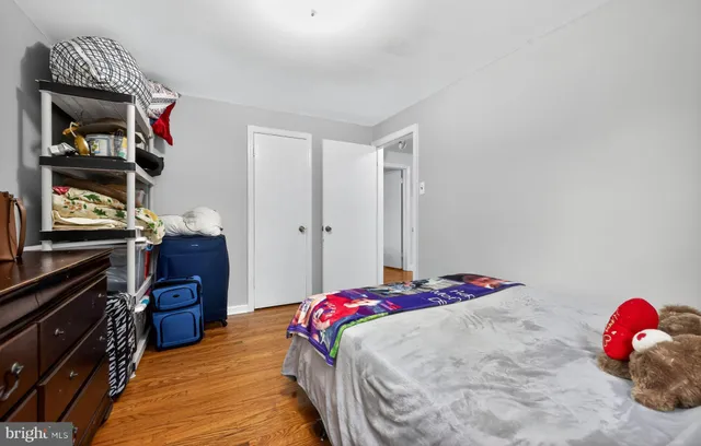 a bedroom with a bed and a closet