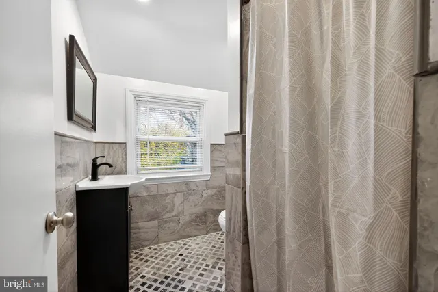 a bathroom with a bathtub and shower