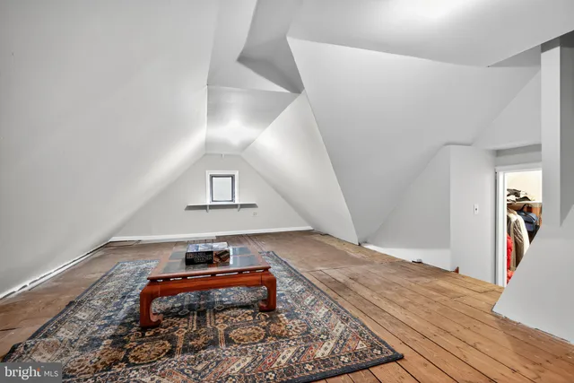 a room with furniture and wooden floor