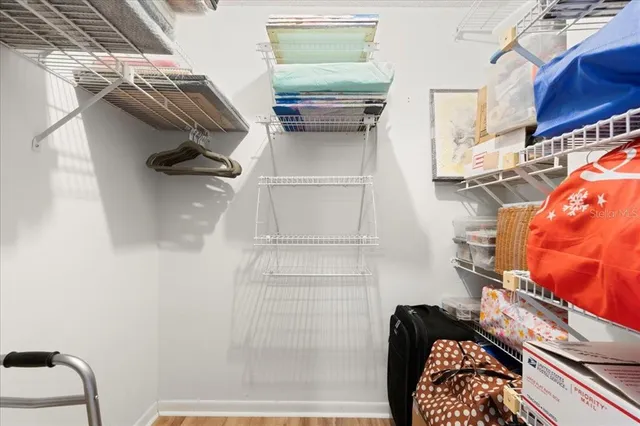 a spacious bathroom with a sink and a mirror