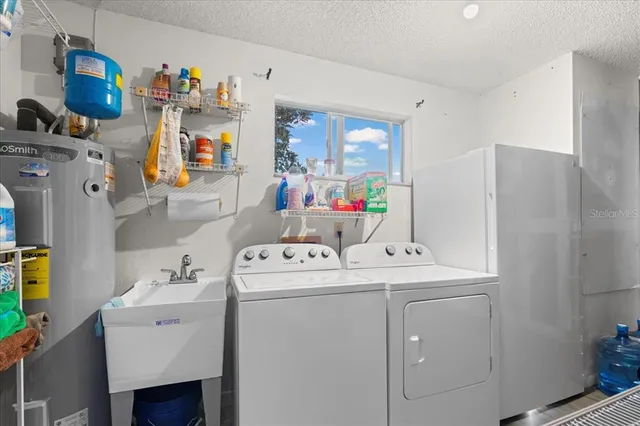 a view of a room with racks air conditioner and a ceiling fan
