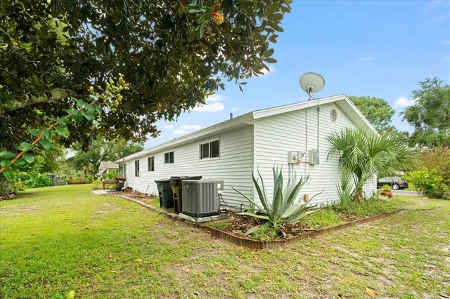 a front view of house with yard having outdoor seating