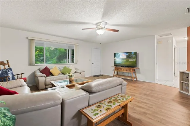 a view of a dining room with furniture and window