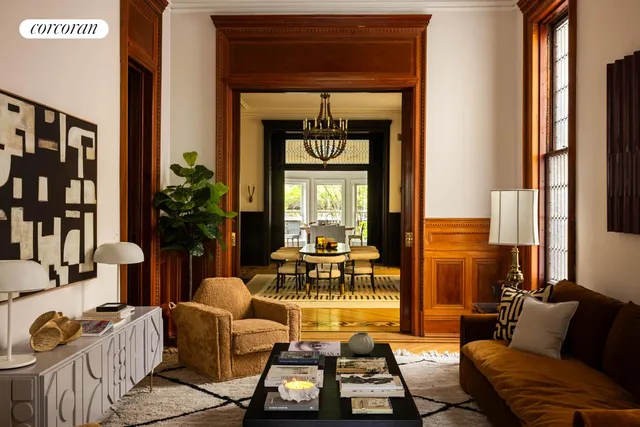 a bedroom with a bed and large windows