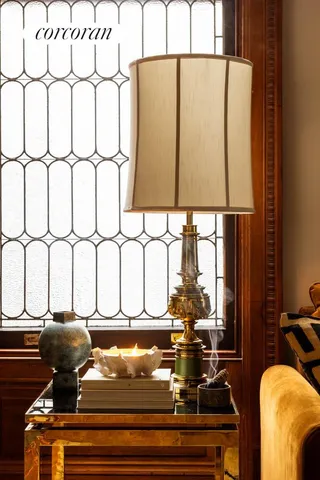 a bedroom with a bed couch and a large window