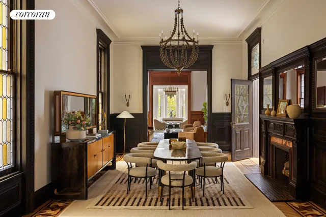 a living room with furniture a rug and a window