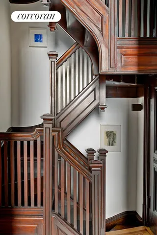 a living room with furniture a fireplace and a chandelier
