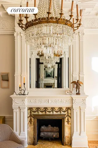 a living room with fireplace furniture and a window