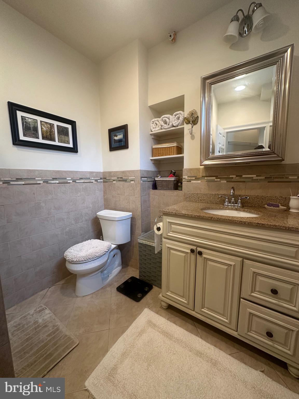 1014 Clinton Street, Unit 2R Philadelphia, PA 19107 - Photo 13 of 16 a bathroom with a toilet sink and mirror