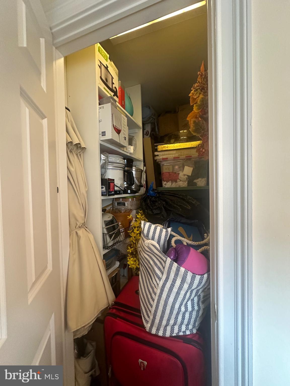 1014 Clinton Street, Unit 2R Philadelphia, PA 19107 - Photo 15 of 16 a view of walk in closet with clothes and shoes