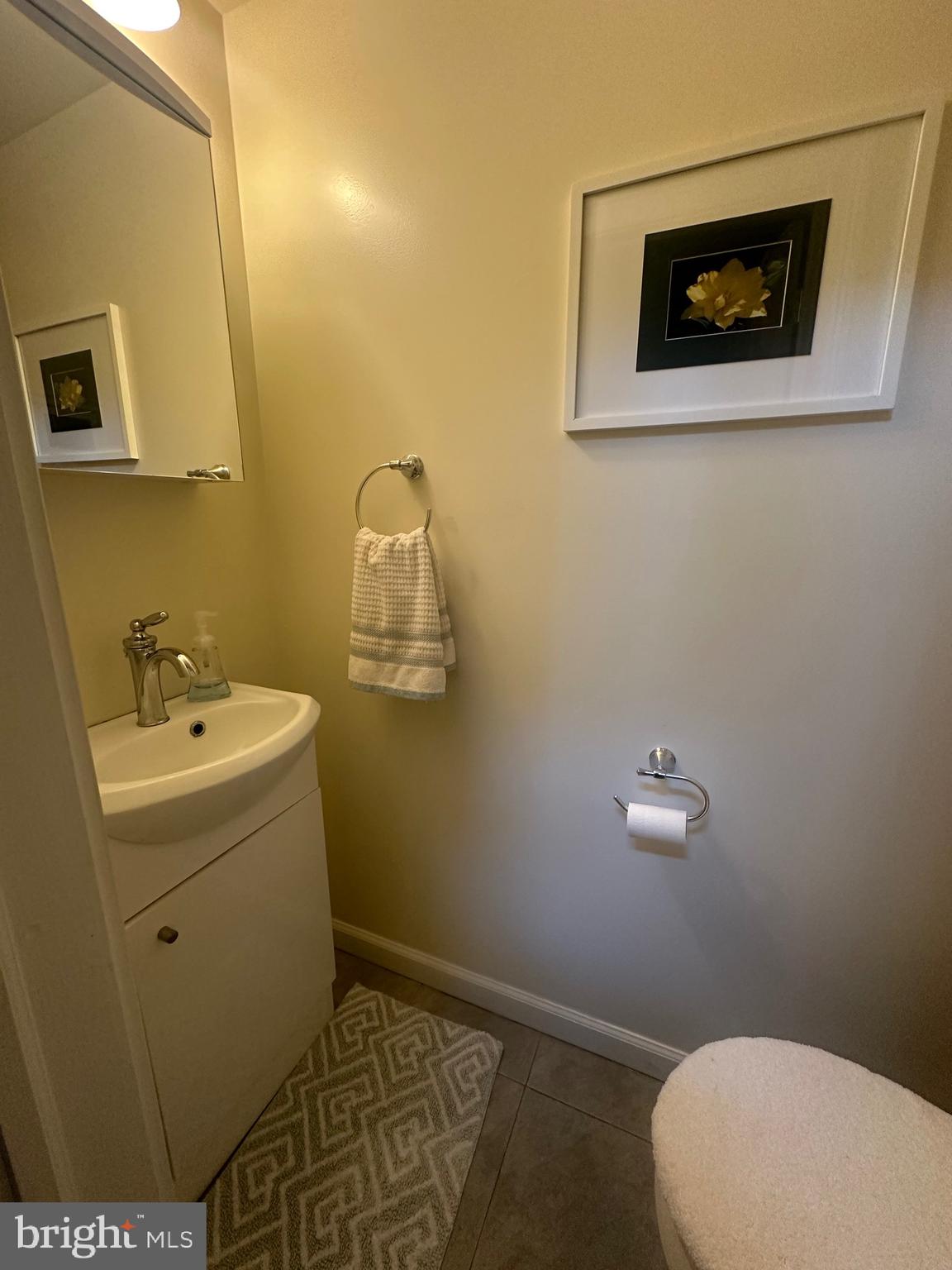 1014 Clinton Street, Unit 2R Philadelphia, PA 19107 - Photo 7 of 16 a bathroom with a sink mirror vanity and toilet
