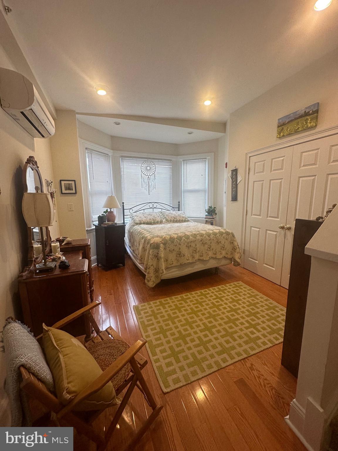 1014 Clinton Street, Unit 2R Philadelphia, PA 19107 - Photo 9 of 16 a bedroom with furniture and a window