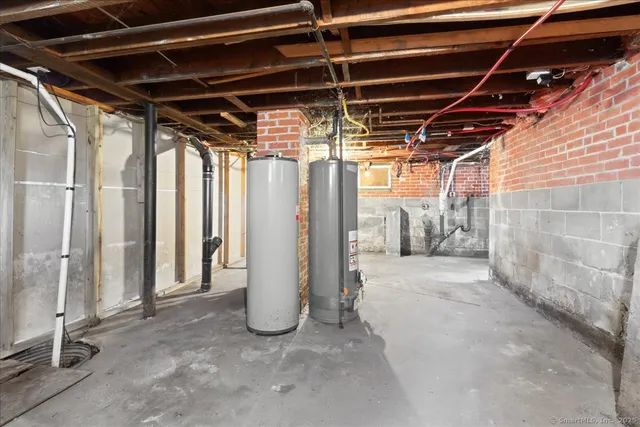 a view of a swimming pool with a yard and large trees