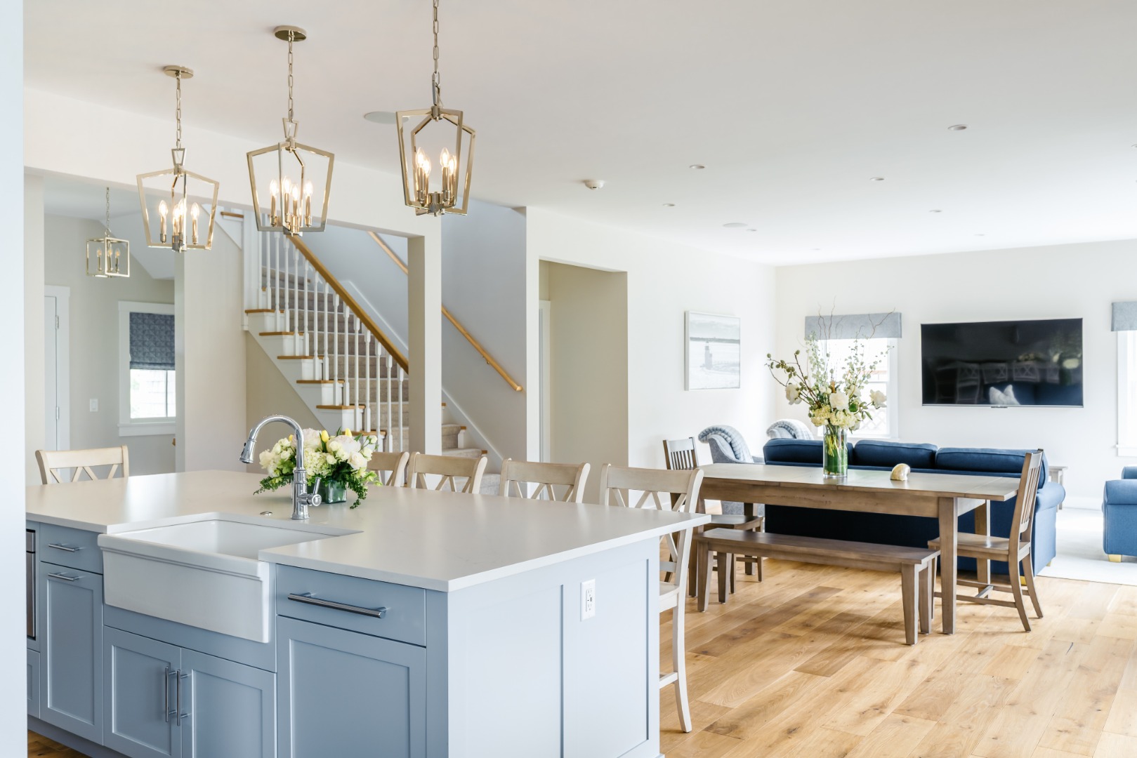 86 Cliff Road Nantucket, MA 02554 - Photo 1 of 29 a view of dining room and kitchen island with furniture and wooden floor