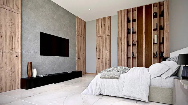 a bedroom with a bed a mirror and dresser