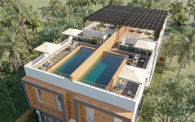 aerial view of a house with a yard