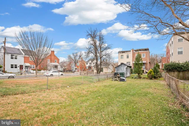 a swimming pool with outdoor seating and yard