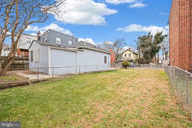a view of a backyard of the house