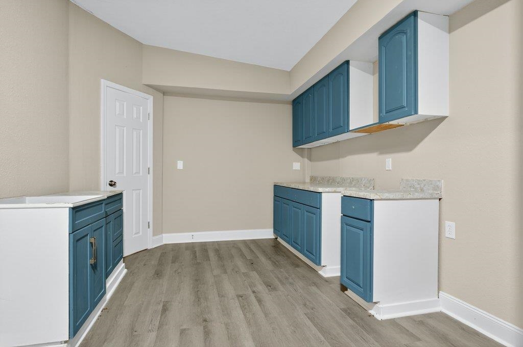 125 Menendez Road St. Augustine, FL 32080 - Photo 27 of 41 a view of a kitchen cabinets and wooden floor