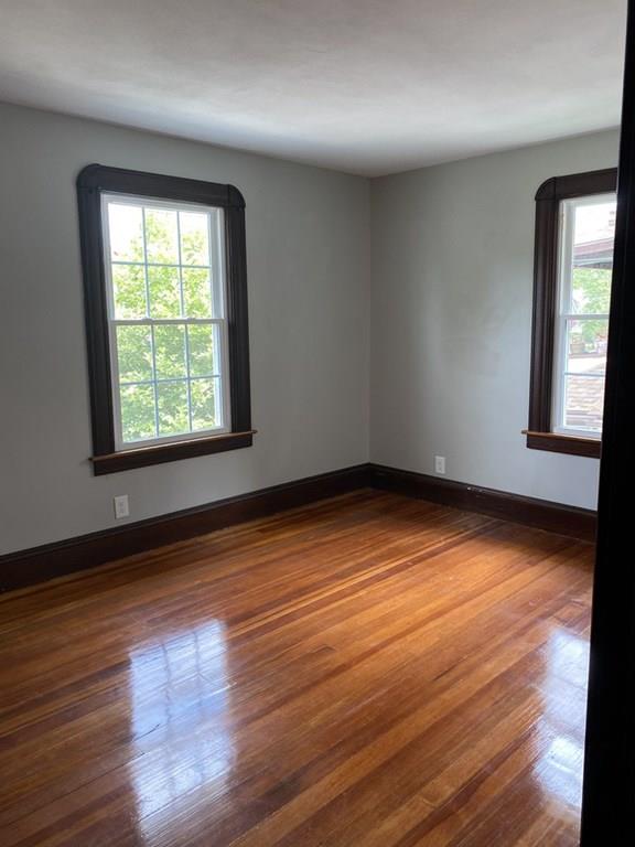 999 Sumner Avenue Springfield, MA 01118 - Photo 12 of 18 a view of empty room with wooden floor and fan