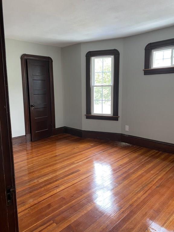 999 Sumner Avenue Springfield, MA 01118 - Photo 13 of 18 a view of empty room with wooden floor and fan