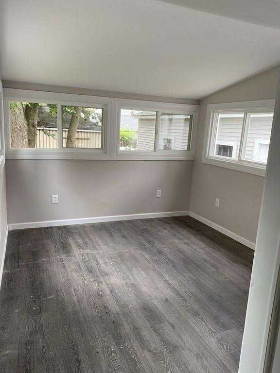 999 Sumner Avenue Springfield, MA 01118 - Photo 18 of 18 an empty room with wooden floor and windows