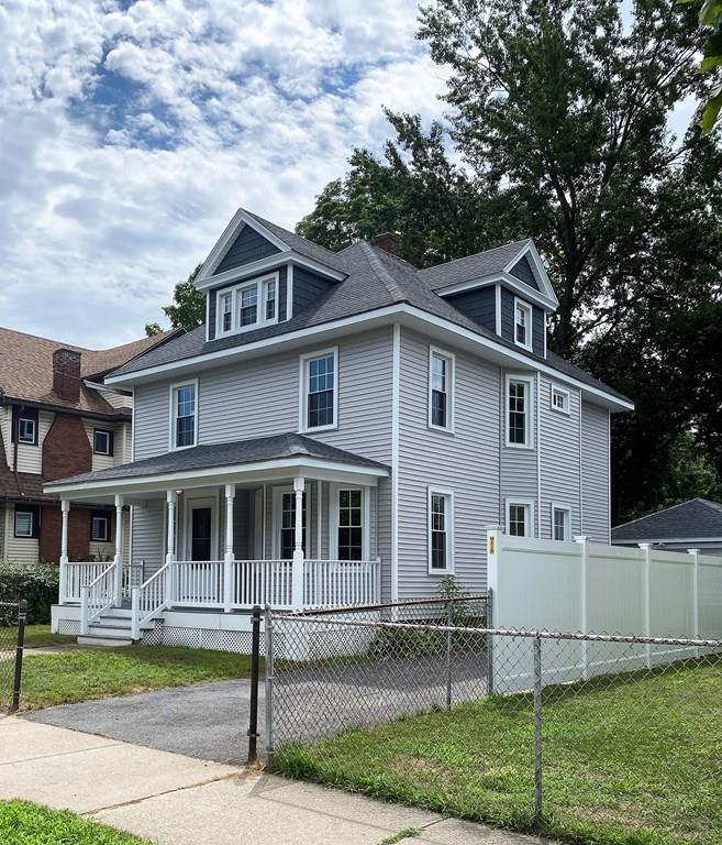 999 Sumner Avenue Springfield, MA 01118 - Photo 2 of 18 a front view of a house with a yard