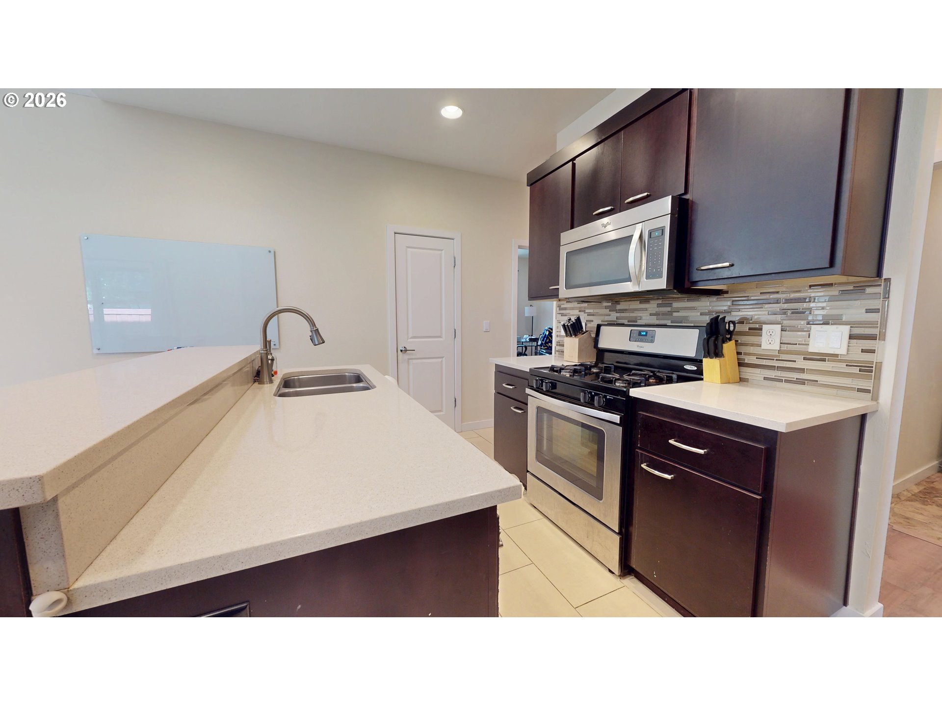 375 Mia Lane Eugene, OR 97401 - Photo 13 of 44 a kitchen with a sink a stove and cabinets