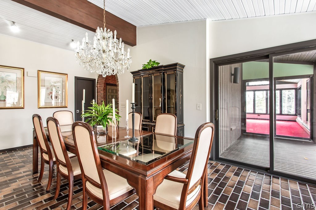 17 Quaker Hill Road DeWitt, NY 13224 - Photo 12 of 50 Dining room with vaulted ceilings and stunning cha