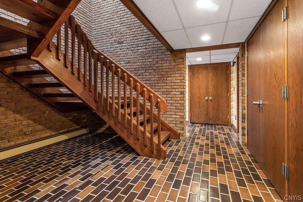 17 Quaker Hill Road DeWitt, NY 13224 - Photo 26 of 50 Stairs from the main foyer down to the lower level