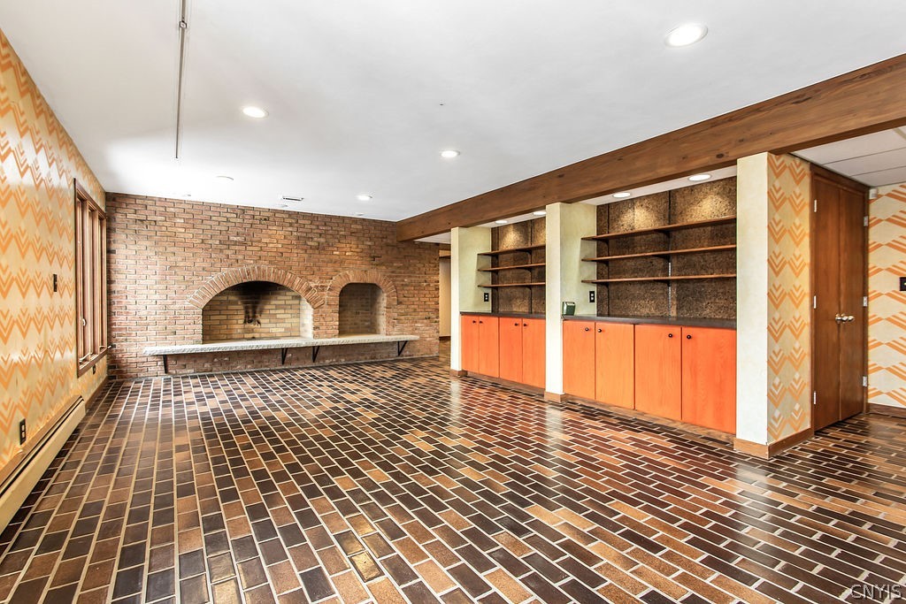 17 Quaker Hill Road DeWitt, NY 13224 - Photo 31 of 50 Expansive lower level family room with wood burnin