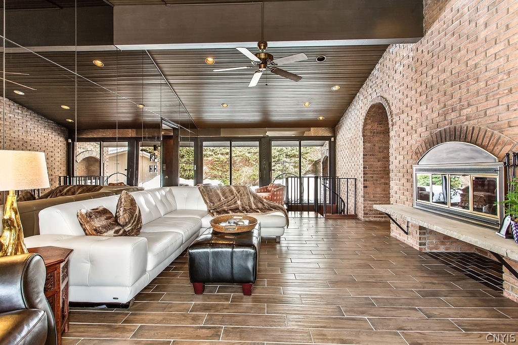 17 Quaker Hill Road DeWitt, NY 13224 - Photo 8 of 50 Vaulted ceilings in the family room as well as por