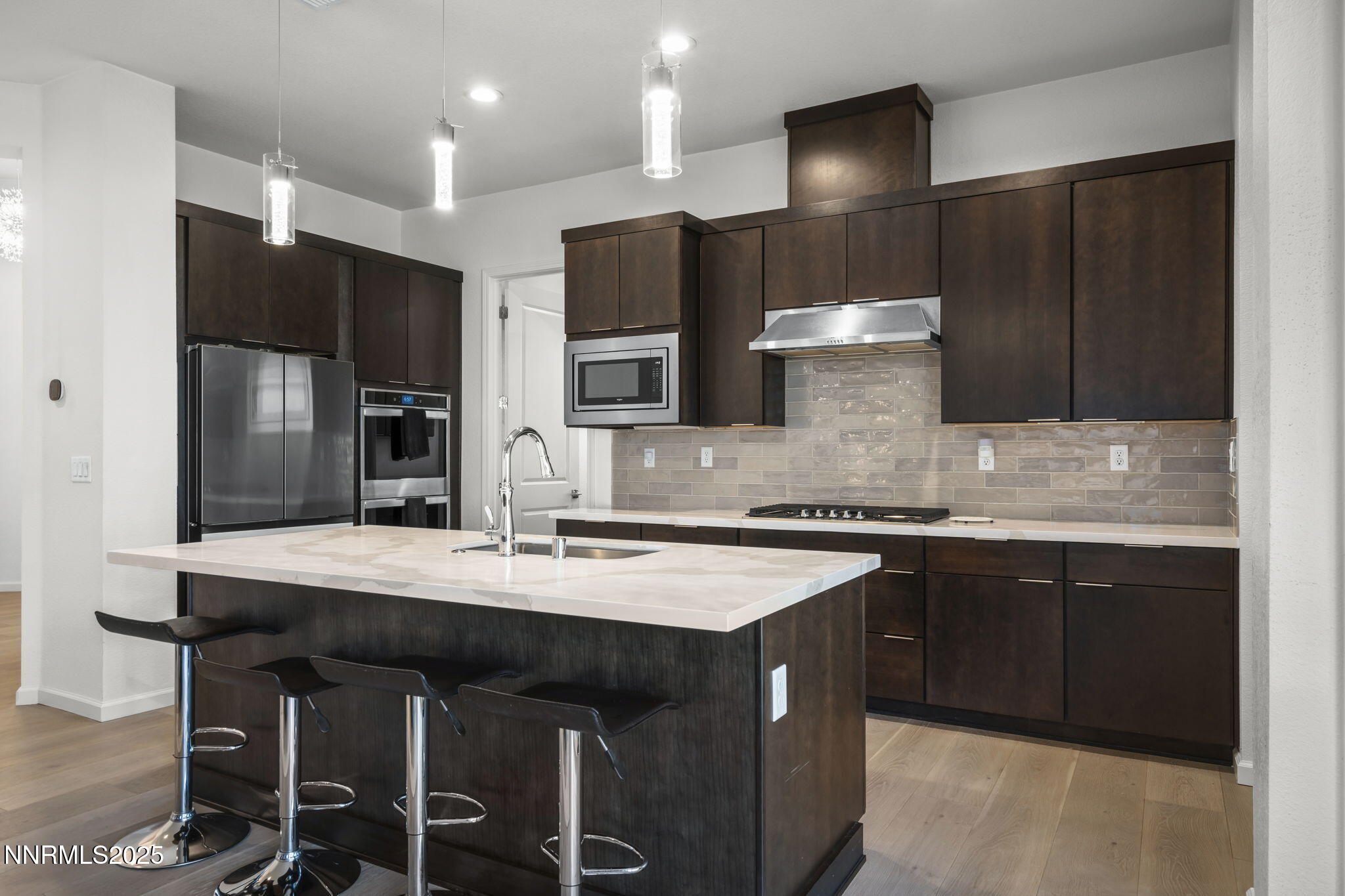 12514 Woods Clover Street Reno, NV 89521 - Photo 12 of 23 a kitchen with stainless steel appliances a sink stove and refrigerator