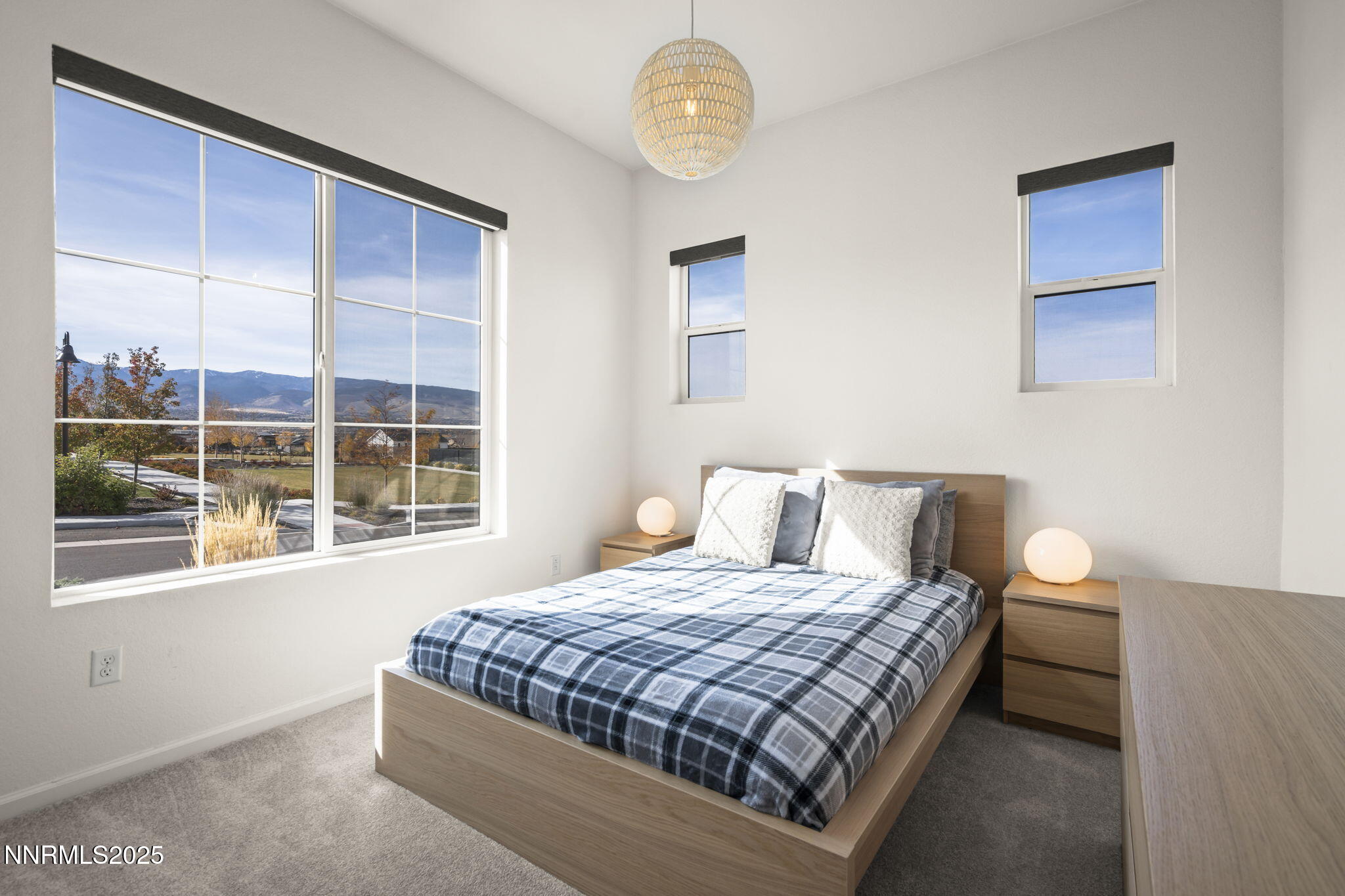 12514 Woods Clover Street Reno, NV 89521 - Photo 14 of 23 a bedroom with a large bed and a window