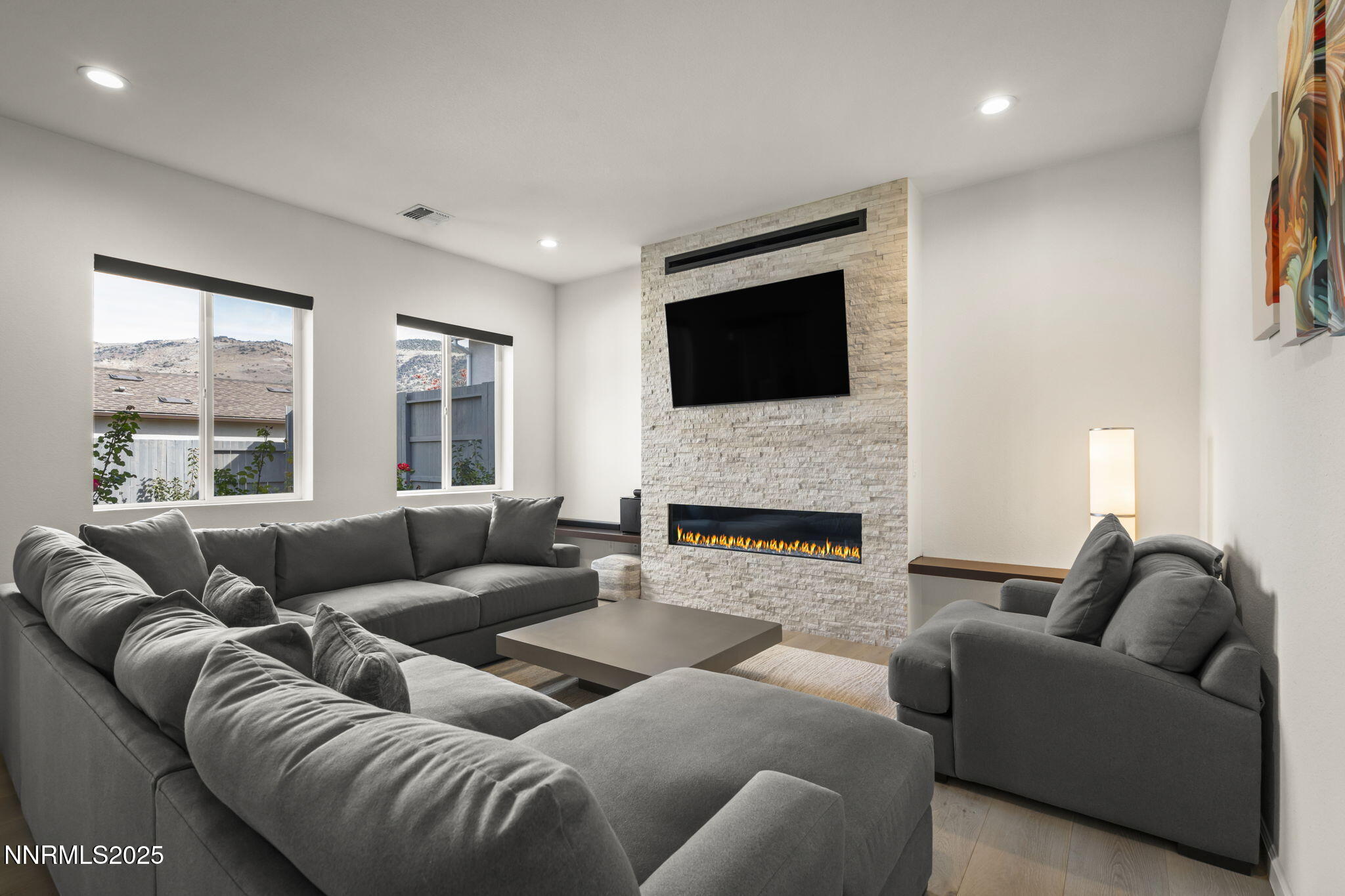 12514 Woods Clover Street Reno, NV 89521 - Photo 3 of 23 a living room with furniture or fireplace and a flat screen tv