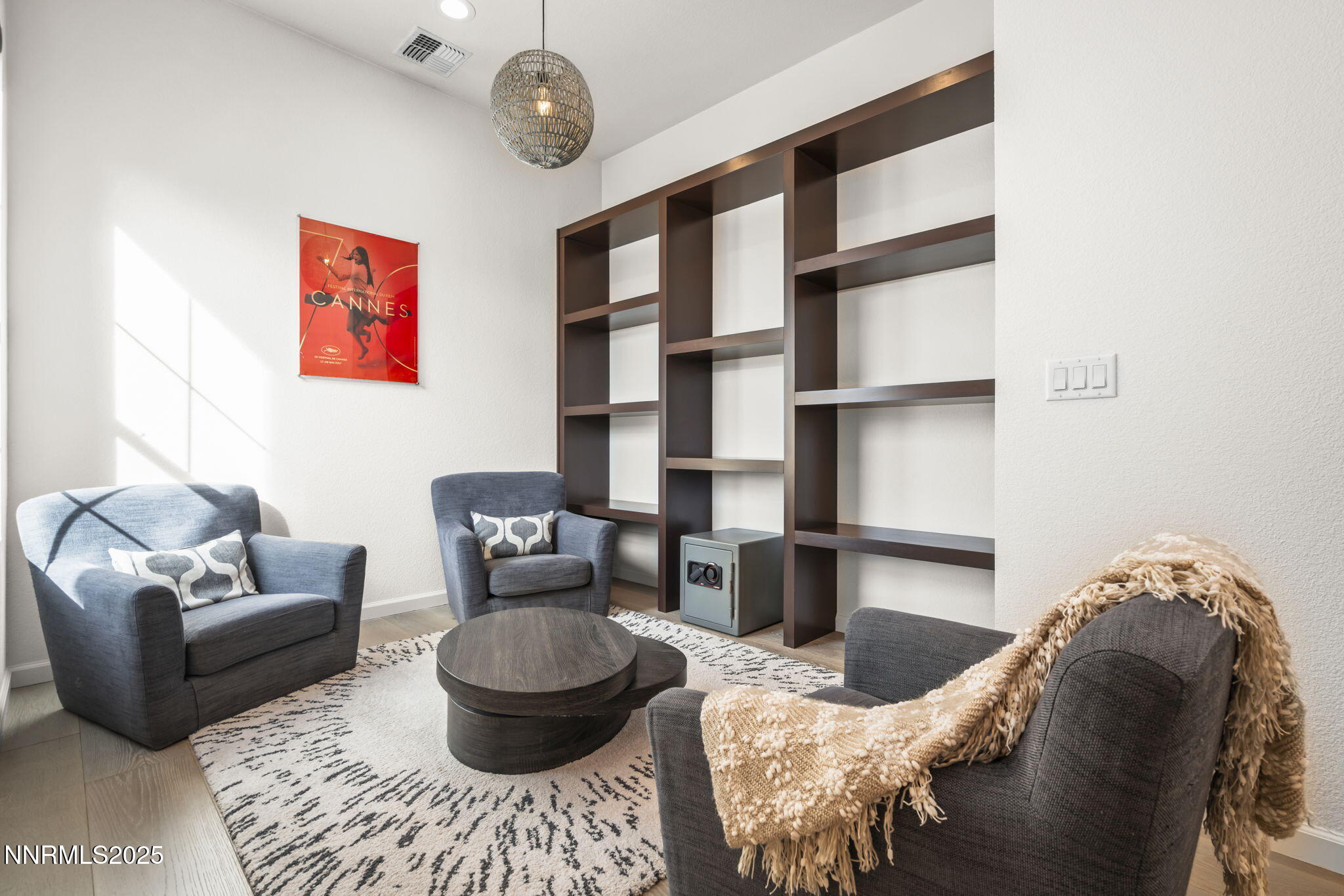 12514 Woods Clover Street Reno, NV 89521 - Photo 8 of 23 a living room with furniture and a painting