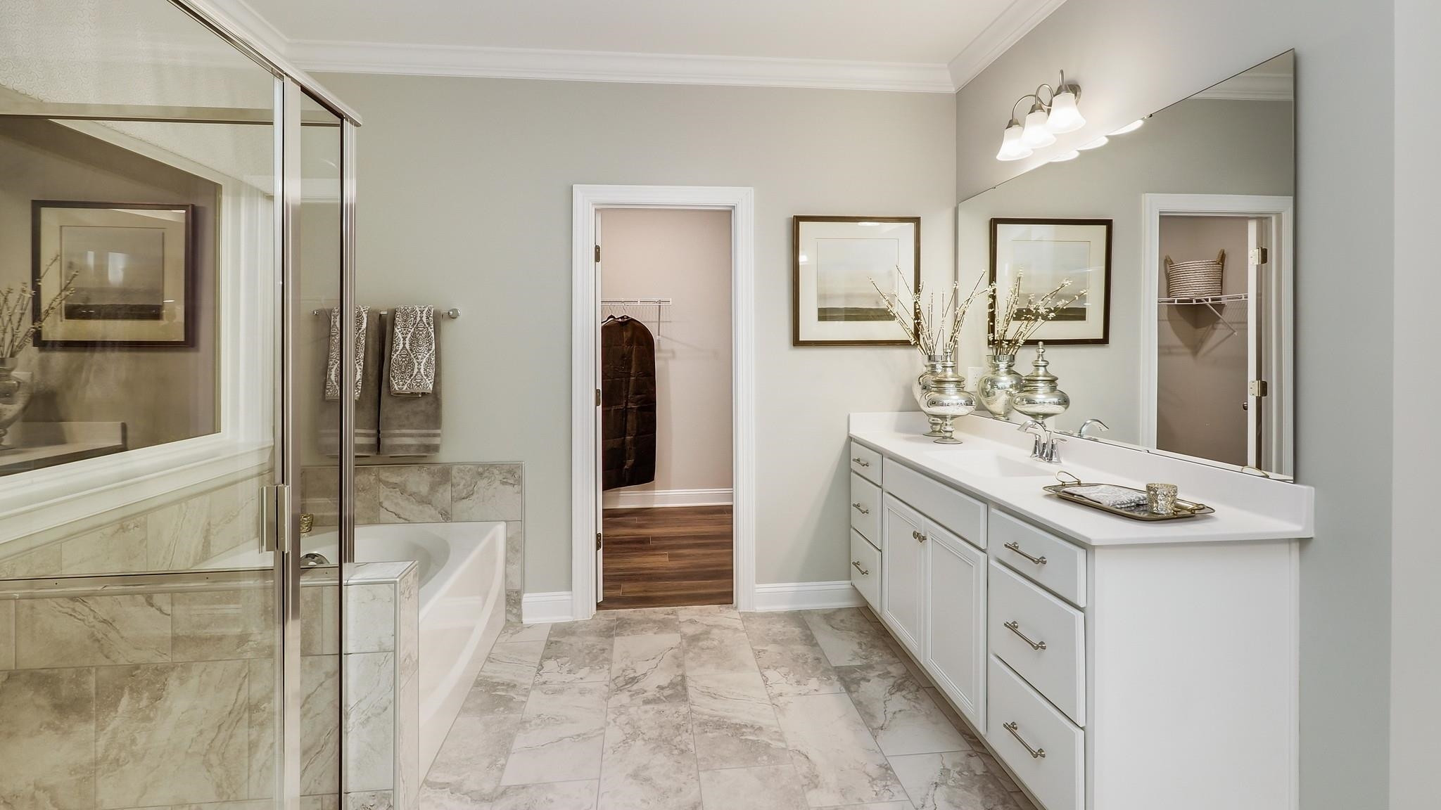 4030 Frontrunner Drive, Unit 46 Durham, NC 27703 - Photo 15 of 25 a bathroom with a double vanity sink and a mirror