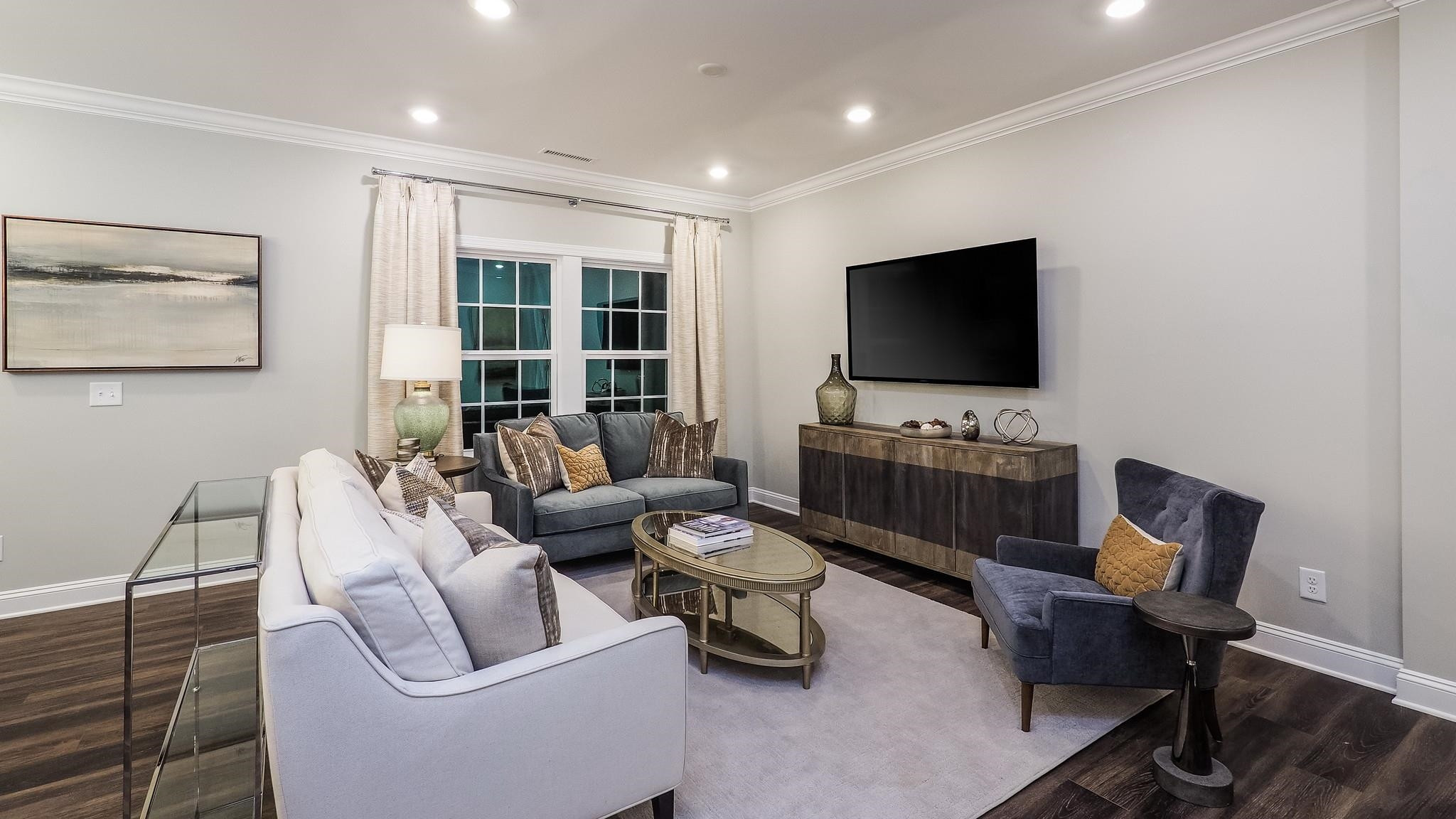 4030 Frontrunner Drive, Unit 46 Durham, NC 27703 - Photo 20 of 25 a living room with furniture and a flat screen tv