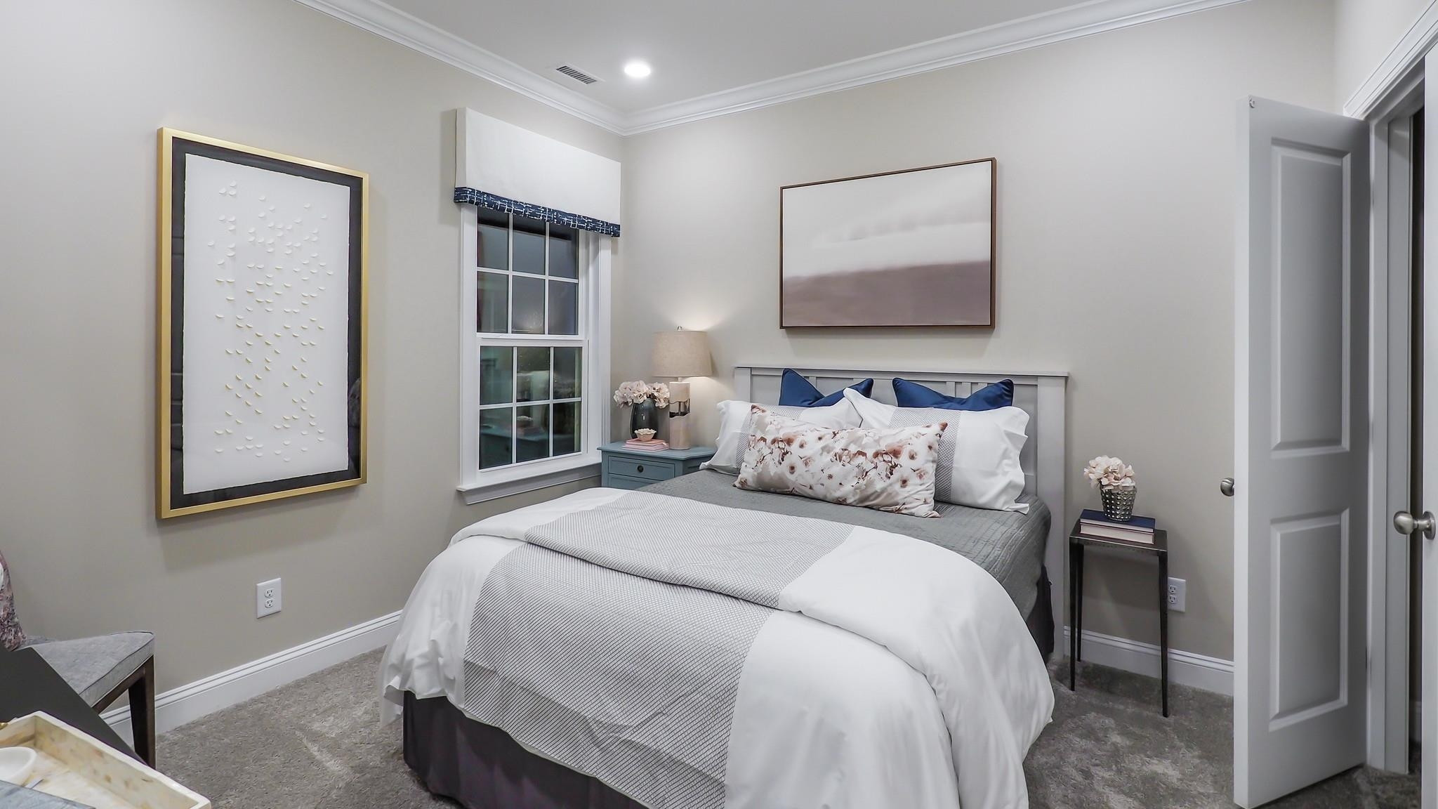 4030 Frontrunner Drive, Unit 46 Durham, NC 27703 - Photo 21 of 25 a bedroom with double bed and a window